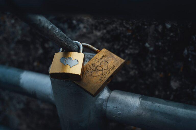 shallow focus photography of two brown padlocks