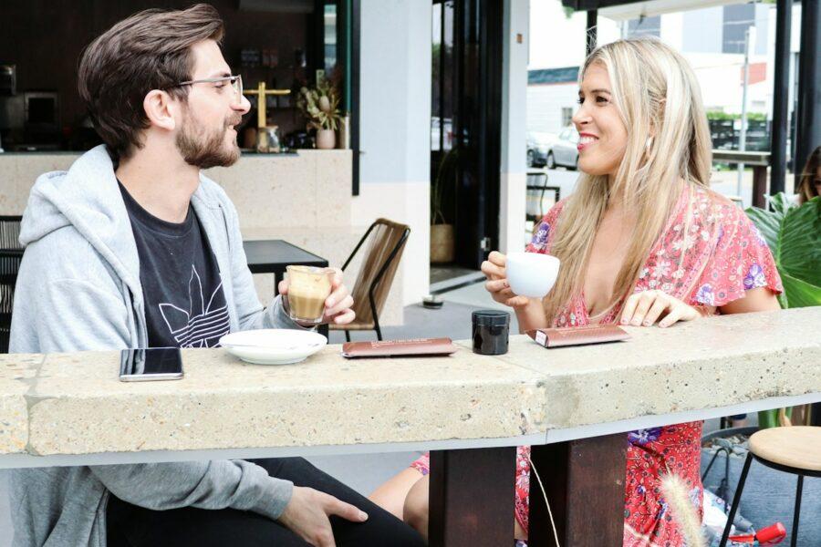 man and woman sitting on chair in restaurant